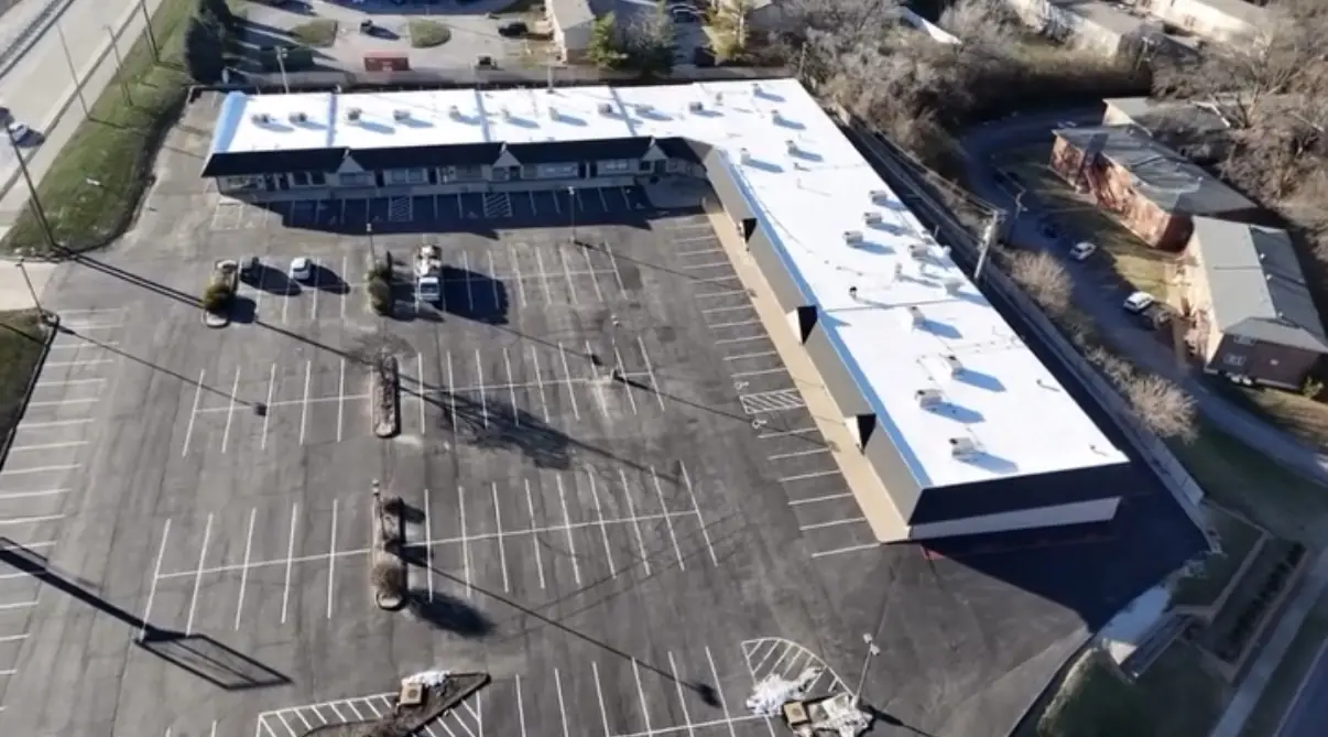 L-shaped retail center with a finished TPO roof